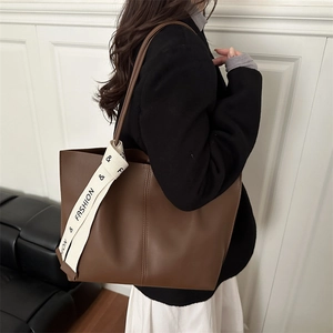 Minimalist large brown leather tote bag with fashion printed strap for daily commuting