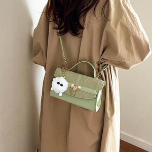 Light green crocodile texture shoulder bag with gold chain and plush ball pendant