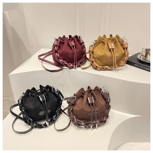 Fashion bucket bags in four colors with drawstring closure and woven shoulder straps