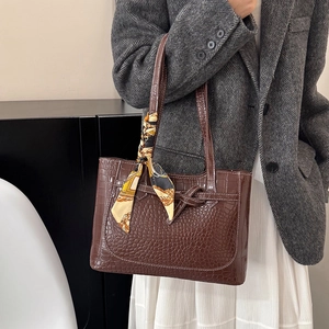 Deep brown croc-embossed tote bag with printed silk scarf and slim shoulder straps