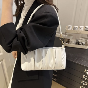 Chic white pleated shoulder bag made of soft faux leather with a woven strap handle