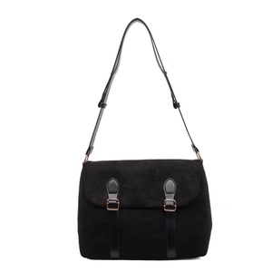 Retro black faux suede underarm tote bag with adjustable straps and buckle hardware