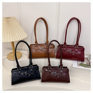 Detail view of large shoulder bags in black, brown, burgundy, and dark coffee colors