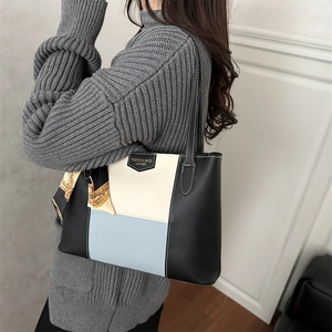 Women's tricolor leather tote bag with silk scarf accessory and fashion label