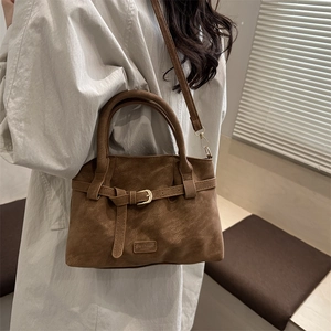 Retro brown suede handbag with decorative strap and adjustable shoulder strap for women