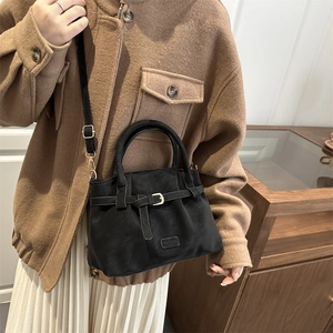 Retro black suede-textured tote bag for women featuring stylish crossbody strap and buckle