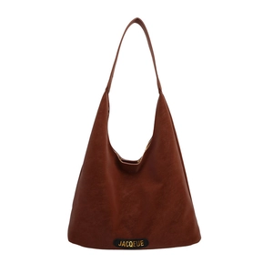 Minimalist brown faux leather tote bag with vintage texture and gold branding