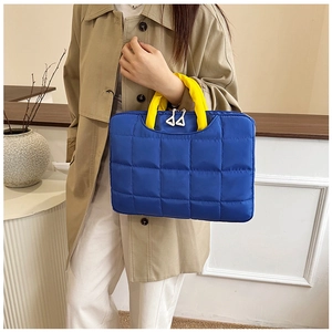 Blue quilted 14-inch laptop bag with yellow handles and silver dual zippers details