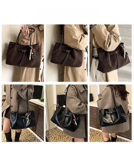 Detail view of large tote bags in brown suede and black leather with wooden bead charms