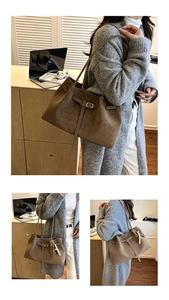 Detail of a brown faux suede tote bag featuring a pearl tassel charm and metal hardware