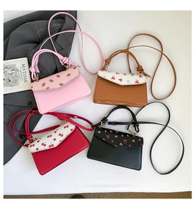 Top view of mini shoulder bags with strawberry, bear, cherry, and floral prints