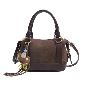 Dark brown suede and leather pillow bag with a cute bear charm and gold hardware