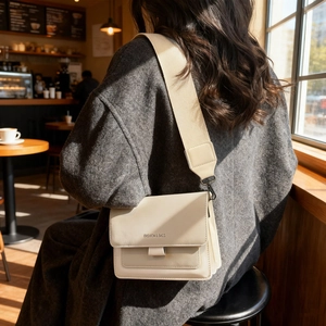 Chic beige PU leather crossbody bag with wide shoulder strap and flap closure design