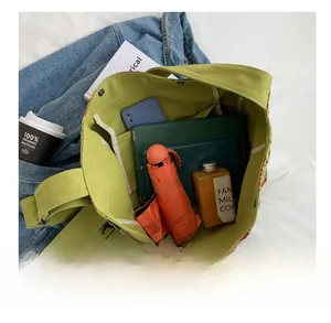 Detailed internal view of large canvas tote bag showing high capacity for tablets and books