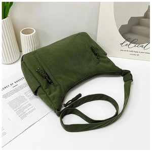 Detail der dunkelgrünen Cord-Einkaufstasche mit Knotenzipper und strukturierter Fläche