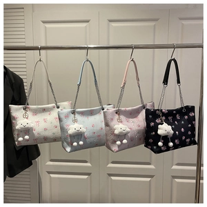 Detail of floral tote bags in four colors with plush cloud charms and chain straps