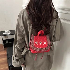 Cute red polka dot backpack with white floral lace trim and drawstring closure