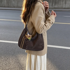 Deep brown minimalist hobo shoulder bag in soft matte leather with cute bear pendant