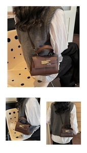 Macro detail of brown litchi pattern leather bag with fine stitching and golden hardware