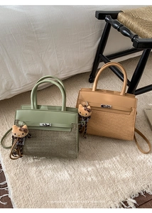 Chic Kelly-style handbags in sage green and khaki leather with woven texture details
