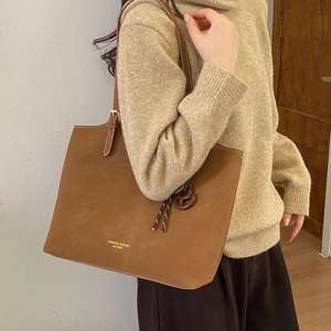 Deep brown large capacity tote bag with suede texture and adjustable shoulder straps