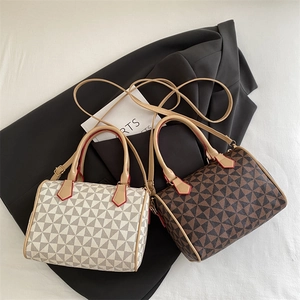 Vintage Boston pillow bags with geometric patterns in beige and dark brown leather