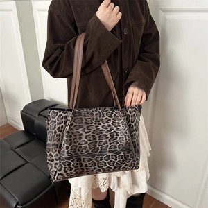 Chic leopard print tote bag with brown leather straps and large capacity for daily commute
