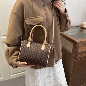Retro Boston bag with windmill pattern, featuring leather handles and shoulder strap