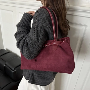 Large burgundy suede tote bag for women showing spacious capacity and retro commute style