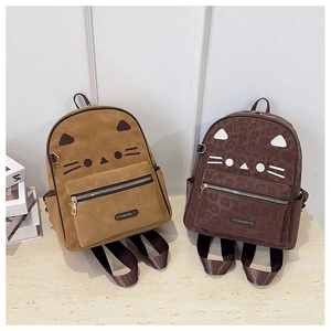 Close-up of cat-themed backpack featuring ear details and leopard print textures