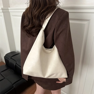 Minimalist cream hobo bag with large capacity and soft faux leather texture for women