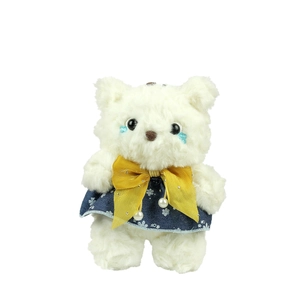 White teddy bear plush keychain wearing a blue floral dress with a yellow bow decoration