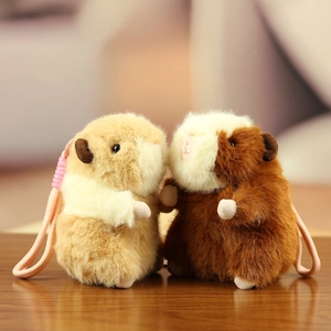 Plush hamster keychain pendants with pink braided cords in brown and tan tones