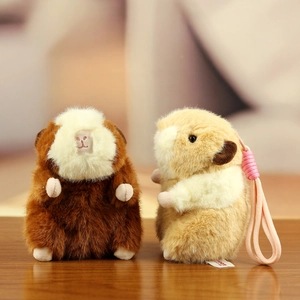Cute capybara plush toy keychains in brown and beige with soft fluffy fur texture