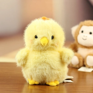 Close-up of soft yellow plush chick pendant with fuzzy texture and cute details
