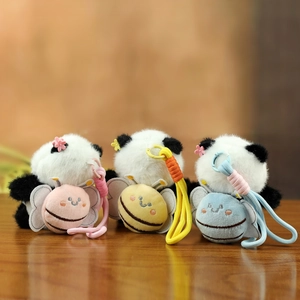 Plush panda keychains in pink, yellow, and blue with honeybee accents for bag decoration