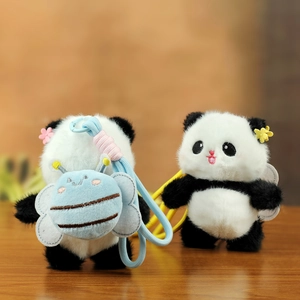 Close-up of plush panda keychain featuring cute expressions and small bee backpack details