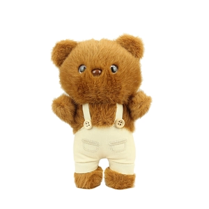 Cute brown plush teddy bear in beige overalls with button detail on white background