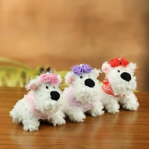 Three cute plush Westie dog keychains with colorful floral headpieces and lace collars