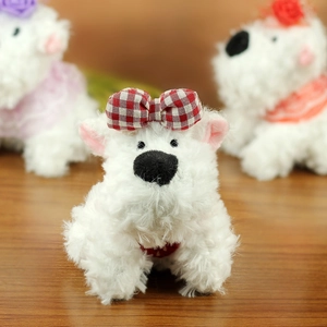 Close-up of white West Highland Terrier plush toy with a red and white checkered bow