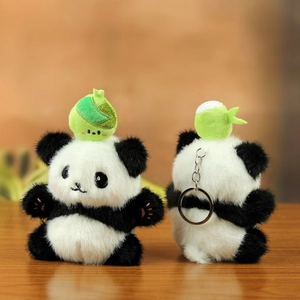 Close-up of cute plush panda keychain with soft fur, embroidered face and green bamboo