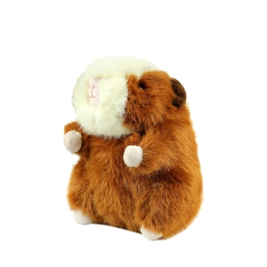 Cute brown and white plush capybara toy standing in a 45-degree angle profile view