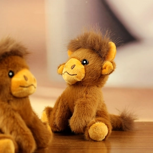 Close-up of a cute plush camel keychain with fluffy dark brown fur and soft texture