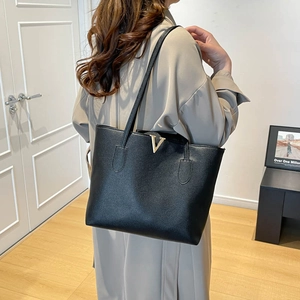Minimalist black tote bag with lychee texture and gold V-metal logo for women