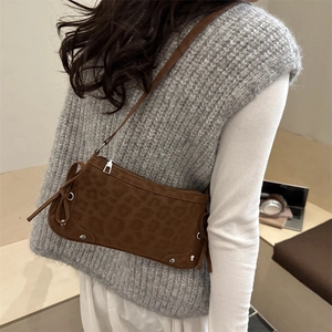 Fashionable leopard print crescent bag with silver studs and side bow details for women