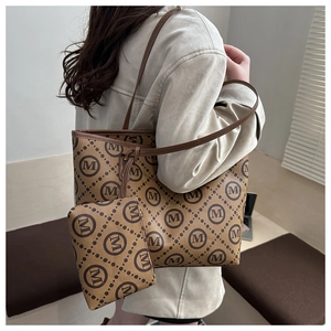 Detail of vintage monogram canvas tote bag set with matching small zipper pouch