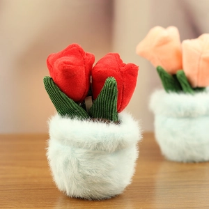 Detail of plush tulip flower pot accessory with vibrant petals and soft faux fur base