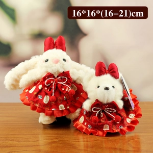 Cute plush rabbit and bear doll pendants in red dresses with festive Fu character