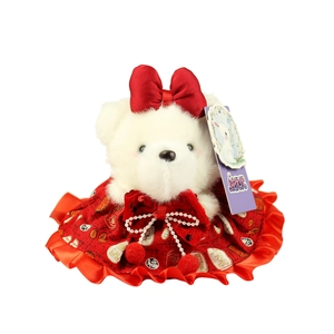 White plush bear in a red festive dress with a bow and lucky Chinese character
