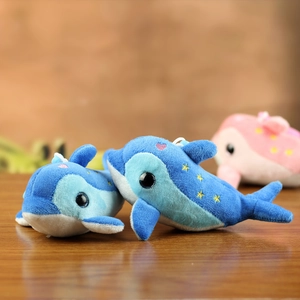 Detailed view of plush dolphin keychains with soft fabric and yellow star embroidery